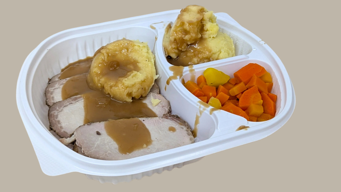 Roast Pork Dinner with Mashed Potatoes & Seasonal Vegetables