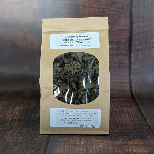 Tea package with window on a wooden surface